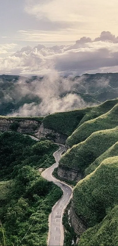 Serene mountain road with lush green hills and cloudy skies.