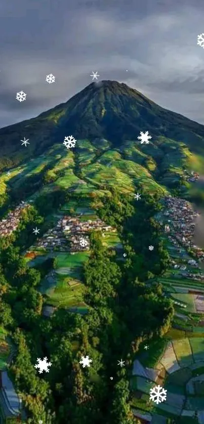 Mountain scenery with green landscapes and snowflakes.