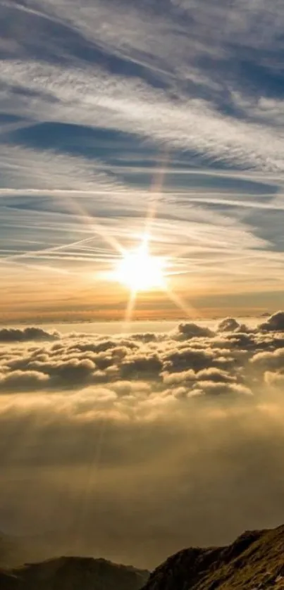 Golden sunrise over mountains with clouds in a serene landscape.