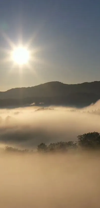 A beautiful mountain sunrise with mist and glowing sun.