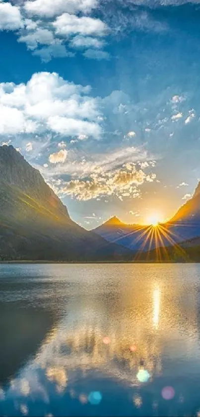 Sunset over mountains with lake reflection, under an azure blue sky.