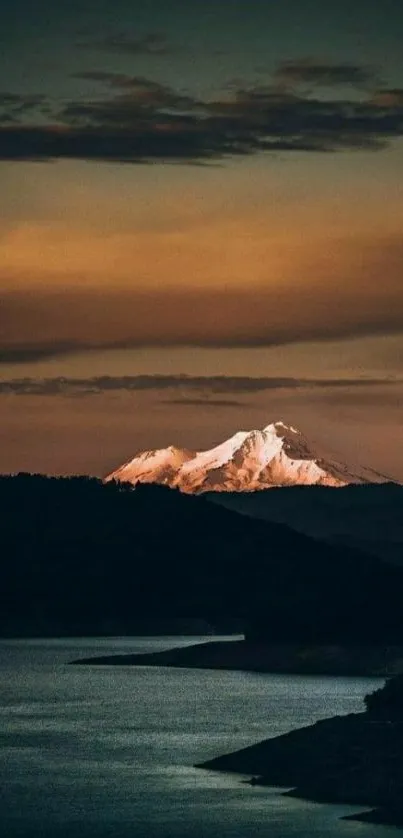 Snow-capped mountain under a rich sunset sky, perfect for a tranquil phone wallpaper.