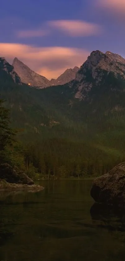 Serene sunset over mountains and lake, perfect for a calming mobile wallpaper.