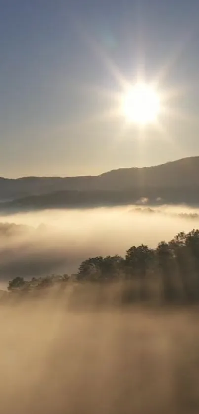 Serene mountain sunset with misty clouds and golden sun rays.