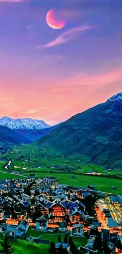 Sunset over mountain village with a vibrant sky.