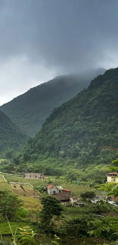 Lush green mountain valley with cloudy sky.