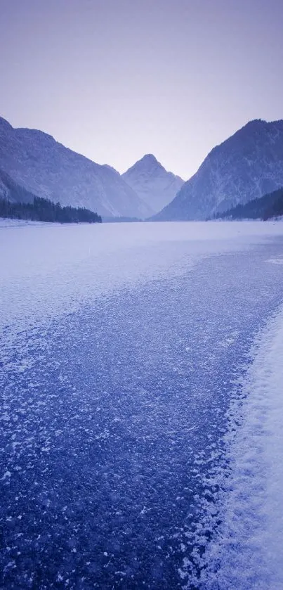Tranquil blue icy lake in mountain landscape wallpaper.