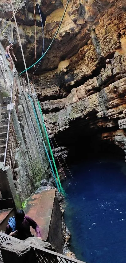 Textured cave with clear blue water.