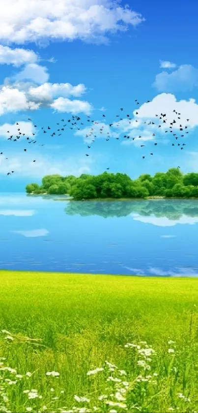Serene nature landscape with blue sky, green fields, and reflective lake.