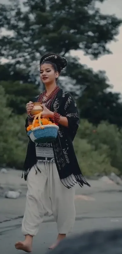 A woman in traditional attire walks barefoot in nature, holding a basket.