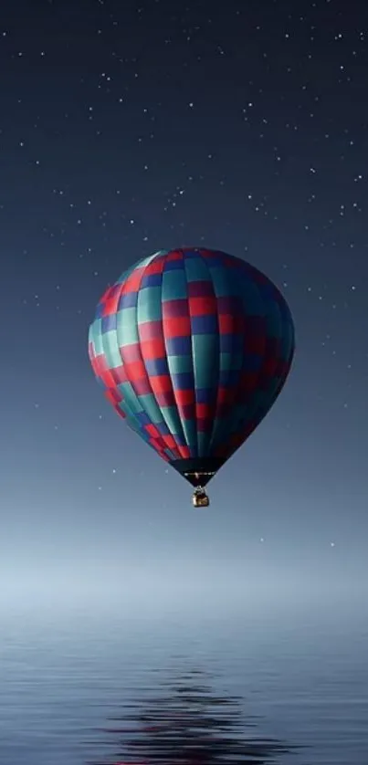 Colorful hot air balloon over a starry sea at night.