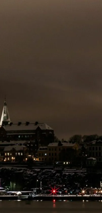 Night cityscape with glowing lights and dark sky.