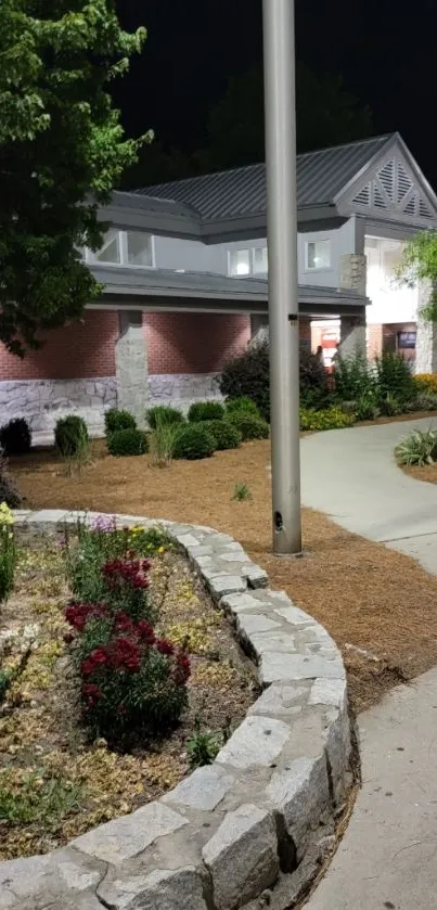 Nighttime garden path with flowers and soft lighting.