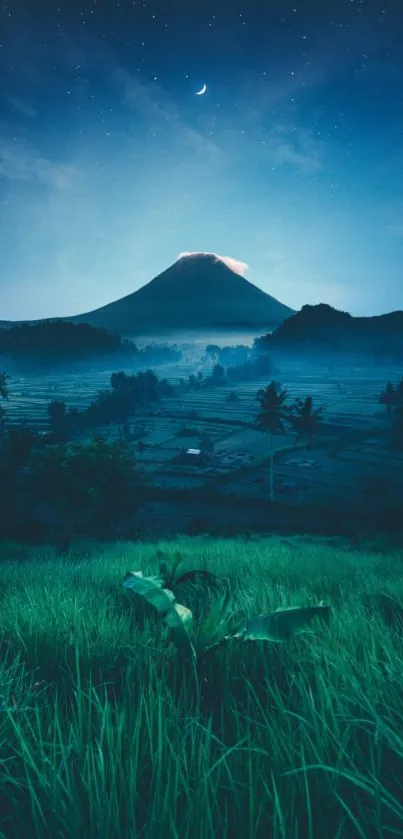 Serene mountain view under night sky with crescent moon and green fields.