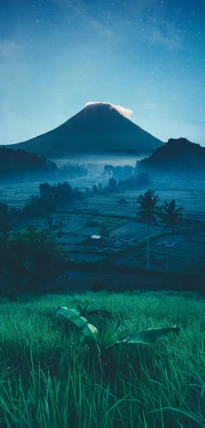 Mountain landscape at night with starry sky and glowing peak.