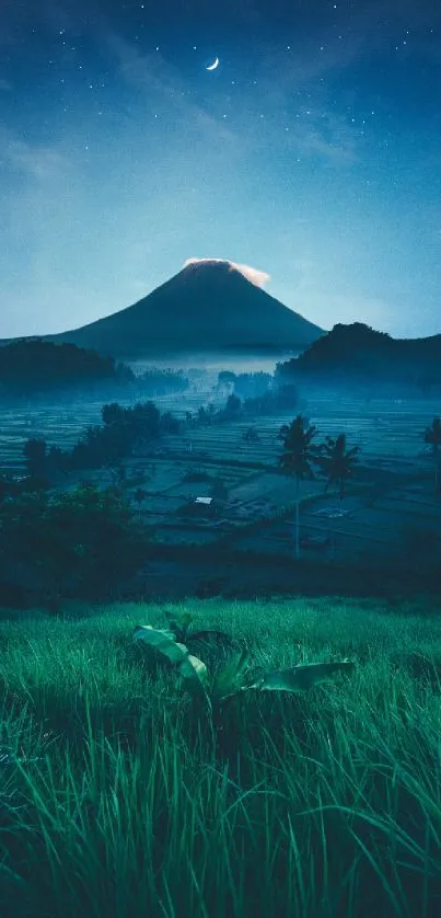 Serene mountain with stars and crescent moon at night over lush green field.