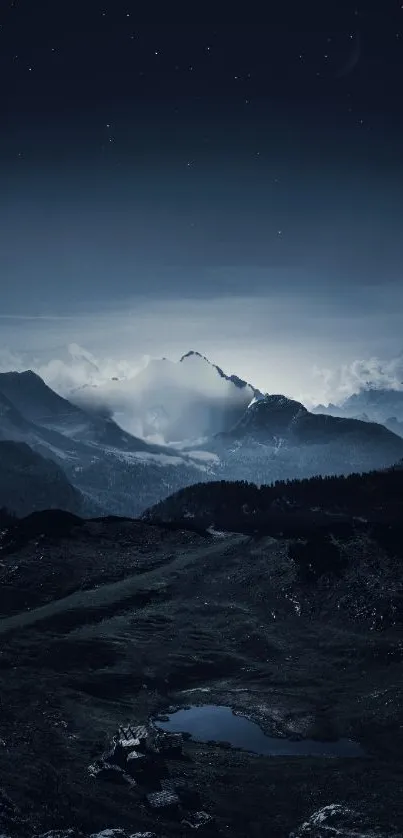 A tranquil night mountain scene beneath a starry night sky.