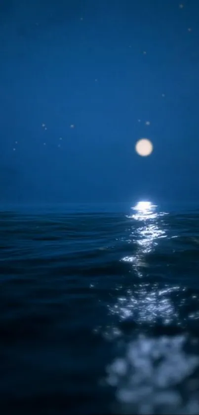 Moonlit ocean with serene night sky reflecting on calm waters.