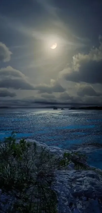 Serene moonlit ocean with clouds and reflection in the night.