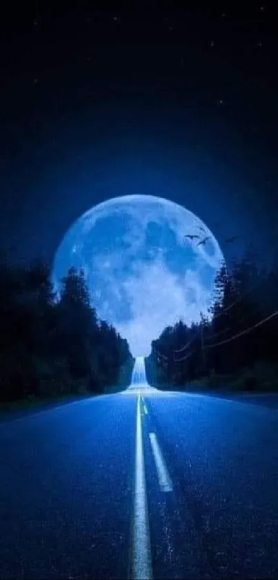 Serene road under a large blue moon in the night sky.