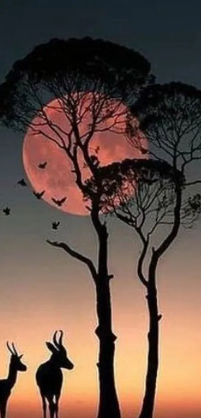 Silhouetted animals and trees under a full moon with an orange sunset.