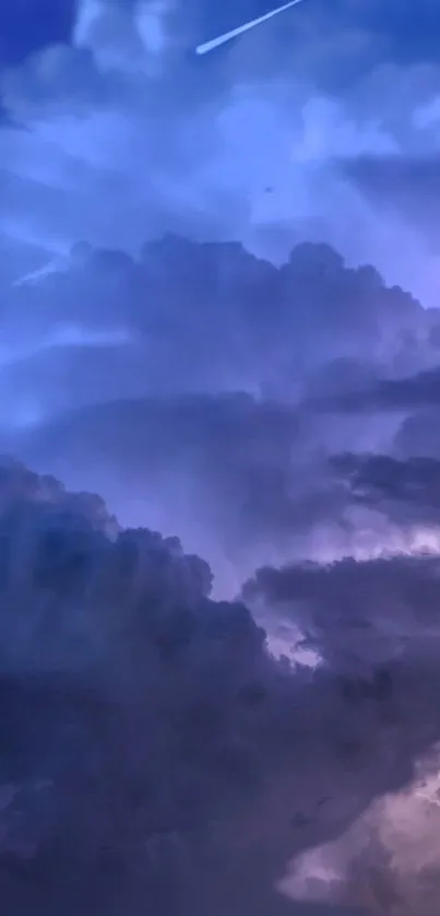 Serene night sky with purple clouds and a shooting star.