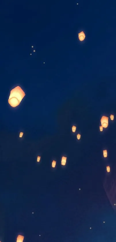 Floating lanterns in a dark blue night sky.