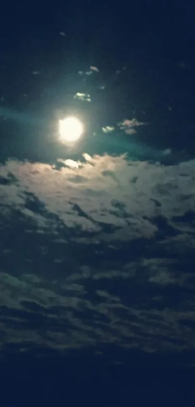 Full moon illuminating textured night clouds.