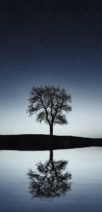 Lone tree reflecting in a tranquil lake under the starry night sky.