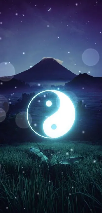 Yin Yang symbol with mountain at night wallpaper.