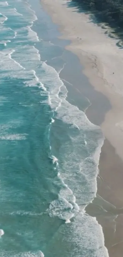 A serene beach with turquoise waves and sandy shores on a mobile wallpaper.