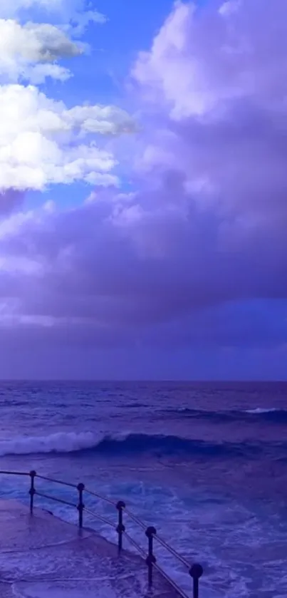 Tranquil ocean and vivid blue sky with soft clouds.