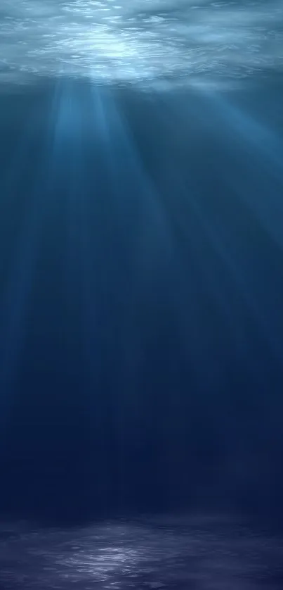 Underwater ocean scene with blue hues and light rays for mobile wallpaper.