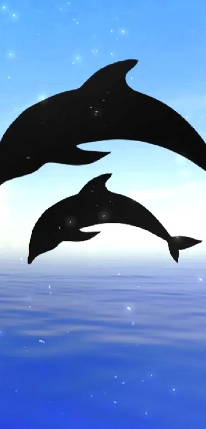 Dolphins swimming under moonlit ocean sky wallpaper.