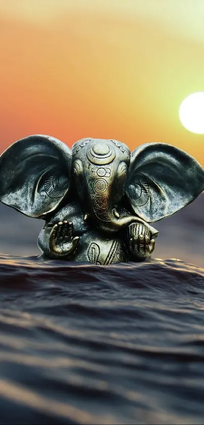 Ganesha statue in ocean at sunset.