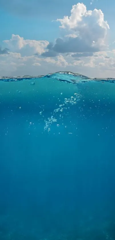 Beautiful calm ocean under a cloudy blue sky.