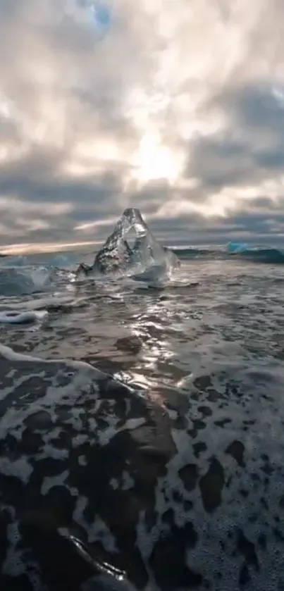 Serene ocean with iceberg under cloudy sky.