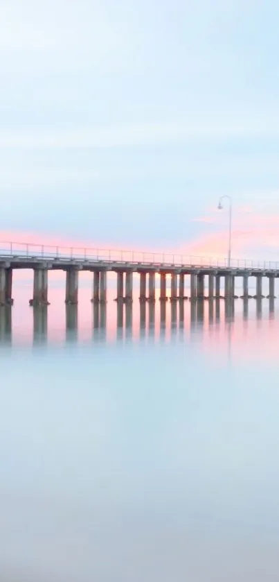 Tranquil pier over calm ocean with pastel skies.