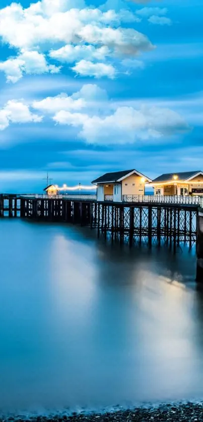 Serene ocean pier with a tranquil blue sky and calm waters.