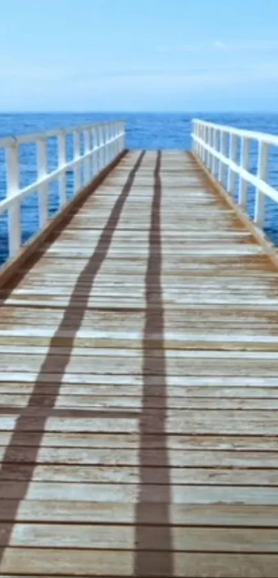 Serene ocean view with wooden pier extending towards horizon.