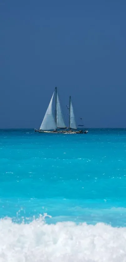 Sailboat gliding on serene blue ocean with clear sky.