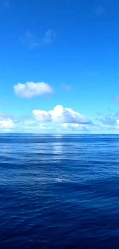 Serene ocean view with blue sky and clouds on mobile wallpaper.