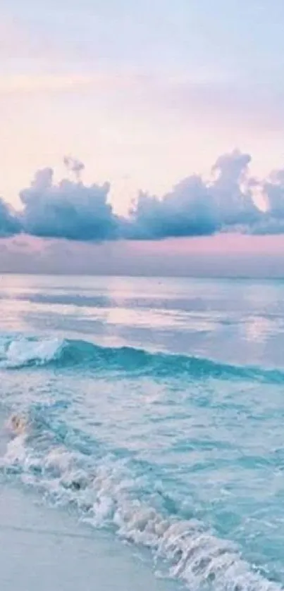 Serene ocean sunrise with pastel skies and gentle waves on a tranquil beach.