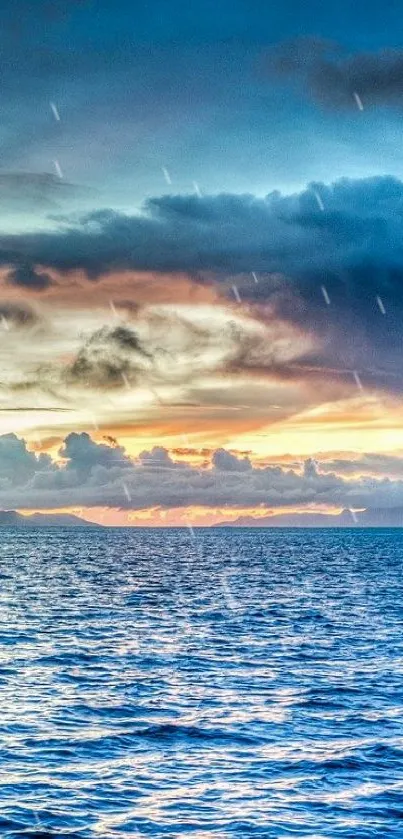 Serene ocean sunset with vibrant blue hues and dynamic clouds.