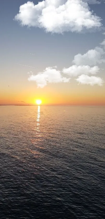 Mobile wallpaper featuring a sunset over the ocean with a pier silhouette.