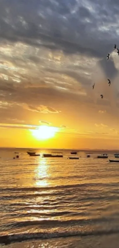 A serene sunset over the ocean with flying birds and peaceful waves.