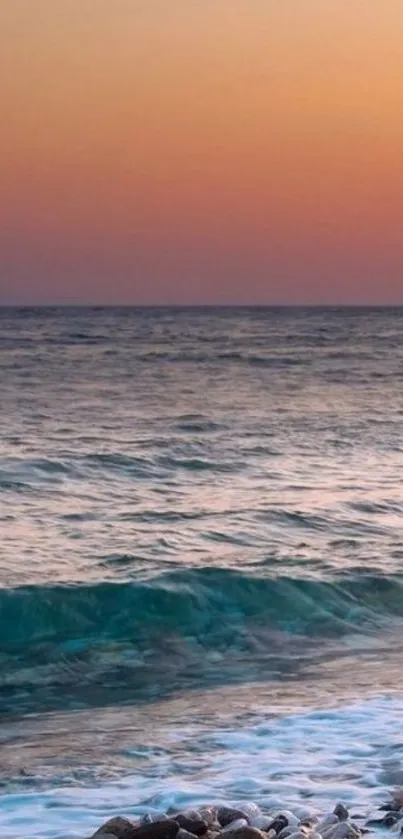 Serene sunset over the ocean with colorful sky.