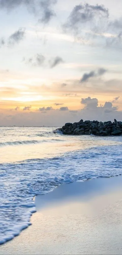 A serene ocean sunset with waves on the shore and a golden sky.