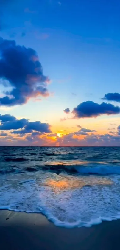 Serene ocean sunset with waves and vibrant sky.