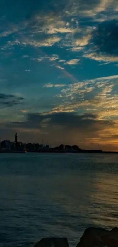 Scenic ocean sunset with vibrant sky and dark blue water.